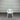 White chair against a corrugated metal wall