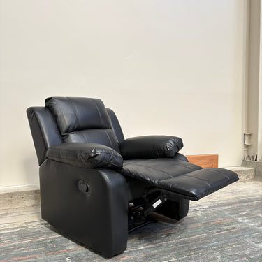 Black faux leather manual recliner chair shown from a side angle with padded armrests