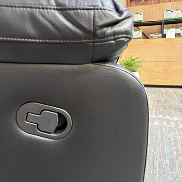Stitching detail on black faux leather recliner chair upholstery
